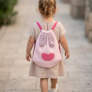 sac à dos rose fabriqué dans du tissu nid d"abeille.petites oreilles en fourrure